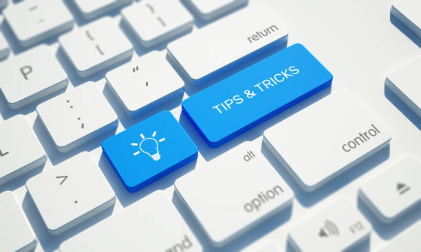 Tips & tricks button on keyboard and light bulb.